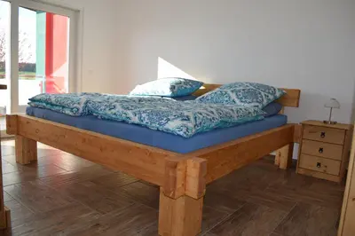 Ein Bett oder Betten in einem Zimmer der Unterkunft Ferienhaus 1 - 55483 Unzenberg