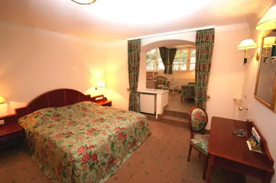 Ein Bett oder Betten in einem Zimmer der Unterkunft Park Hotel am Schloss