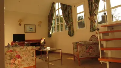 Ein Sitzbereich in der Unterkunft Park Hotel am Schloss