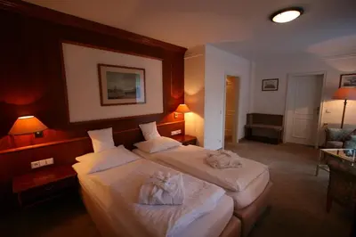 Ein Bett oder Betten in einem Zimmer der Unterkunft Park Hotel am Schloss