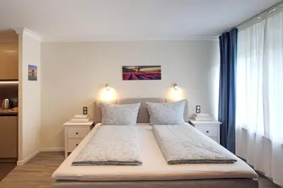 Ein Bett oder Betten in einem Zimmer der Unterkunft S.F.C. Apartments