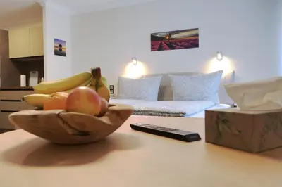 Ein Bett oder Betten in einem Zimmer der Unterkunft S.F.C. Apartments