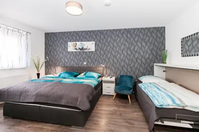 Ein Bett oder Betten in einem Zimmer der Unterkunft Kaiser-Ferienwohnungen am Rheinsteig