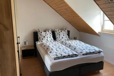 Ein Bett oder Betten in einem Zimmer der Unterkunft Ferienwohnung Moselgold