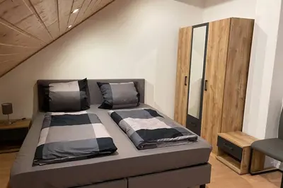 Ein Bett oder Betten in einem Zimmer der Unterkunft Ferienwohnung Moselgold