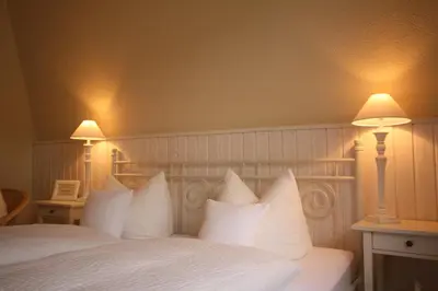 Ein Bett oder Betten in einem Zimmer der Unterkunft Hotel Pfälzer Hof