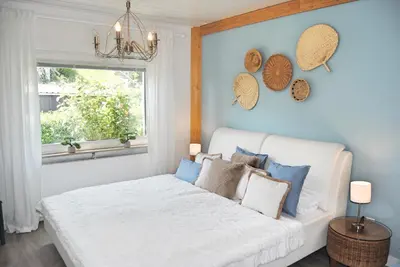 Ein Bett oder Betten in einem Zimmer der Unterkunft Stilvolles Eifelhaus am Nürburgring mit eigenem Garten