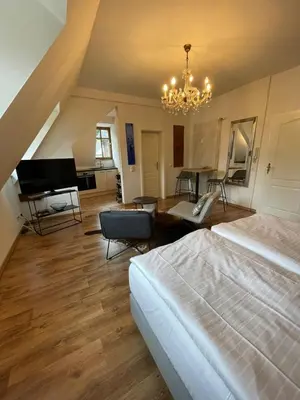 Ein Bett oder Betten in einem Zimmer der Unterkunft FEWO Schlossberg Weingut C.A. Haussmann