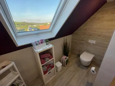 Ein Badezimmer in der Unterkunft Haus Lotusblüte