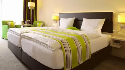 Ein Bett oder Betten in einem Zimmer der Unterkunft Landgasthof Eiserner Ritter