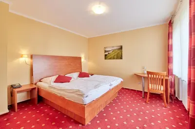 Ein Bett oder Betten in einem Zimmer der Unterkunft Hotel Café Ernst