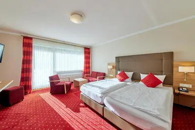 Ein Bett oder Betten in einem Zimmer der Unterkunft Hotel Café Ernst