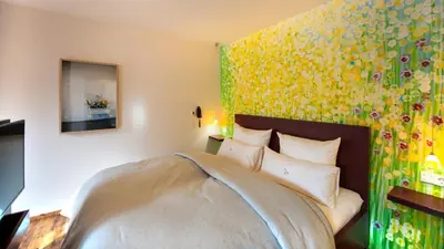 Ein Bett oder Betten in einem Zimmer der Unterkunft Romantik Hotel Meisenheimer Hof