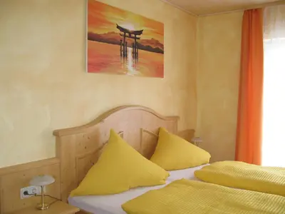 Ein Bett oder Betten in einem Zimmer der Unterkunft Zur Rotenfelsstube