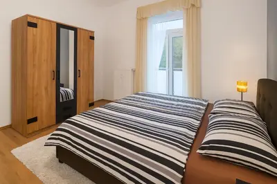 Ein Bett oder Betten in einem Zimmer der Unterkunft Apartments an der Lahn