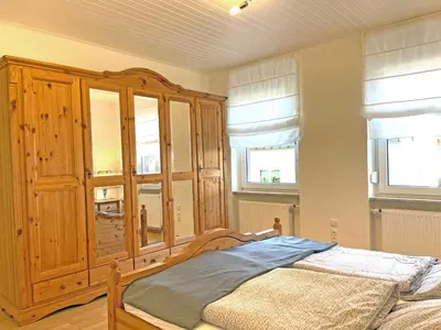 Ein Bett oder Betten in einem Zimmer der Unterkunft Altes Winzerhaus am Moselufer - Goldgrube