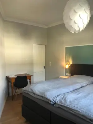 Ein Bett oder Betten in einem Zimmer der Unterkunft MoselLiebe
