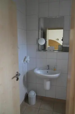 Ein Badezimmer in der Unterkunft Hotel Pit Lane 