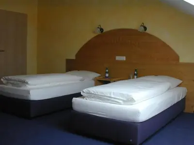 Ein Bett oder Betten in einem Zimmer der Unterkunft Hotel Pit Lane 