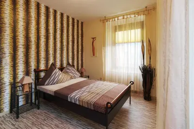 Ein Bett oder Betten in einem Zimmer der Unterkunft Mosella Ferienwohnungen