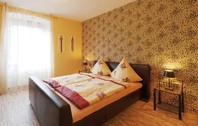 Ein Bett oder Betten in einem Zimmer der Unterkunft Mosella Ferienwohnungen