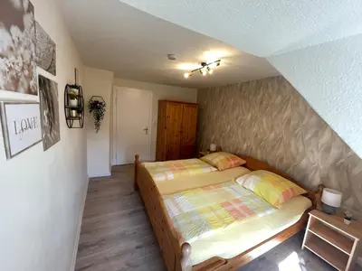 Ein Bett oder Betten in einem Zimmer der Unterkunft Moselferienhaus Porten
