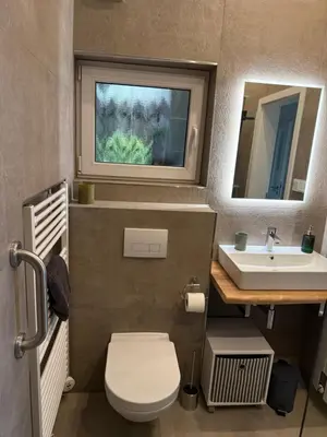 Ein Badezimmer in der Unterkunft Eifelhäuschen am See