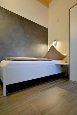 Ein Bett oder Betten in einem Zimmer der Unterkunft Ferienhäuser Brieden - 