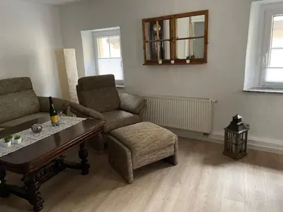 Ein Sitzbereich in der Unterkunft Ferienhaus am Fallertor