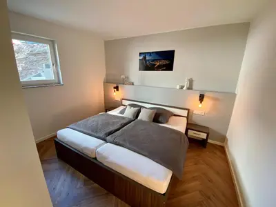 Ein Bett oder Betten in einem Zimmer der Unterkunft Mosel-FeWo-JuLe