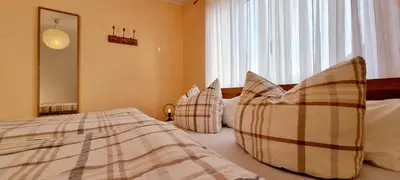 Ein Bett oder Betten in einem Zimmer der Unterkunft Ferienhaus Antiquarius