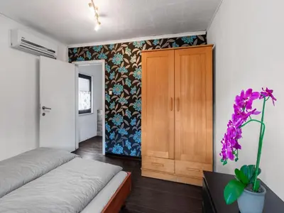 Ein Bett oder Betten in einem Zimmer der Unterkunft Charmantes Ferienhaus nahe Moselufer