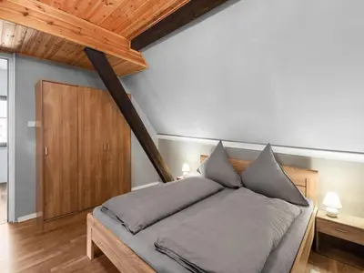 Ein Bett oder Betten in einem Zimmer der Unterkunft Charmantes Ferienhaus nahe Moselufer
