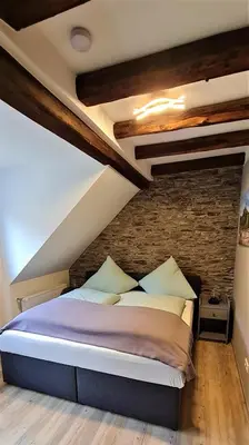 Ein Bett oder Betten in einem Zimmer der Unterkunft Ferienwohnung am Fluß