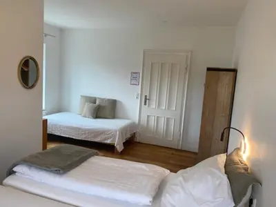 Ein Bett oder Betten in einem Zimmer der Unterkunft Die Strumpffabrik - Guesthouse