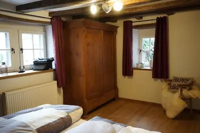 Ein Bett oder Betten in einem Zimmer der Unterkunft Hedwigs Hexenhäuschen