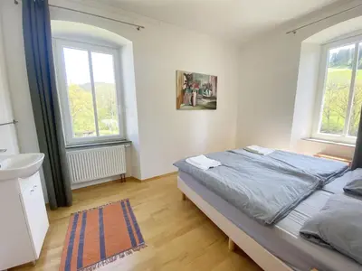 Ein Bett oder Betten in einem Zimmer der Unterkunft Ferienhaus Rehblick