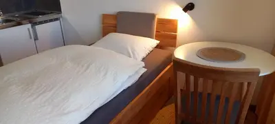 Ein Bett oder Betten in einem Zimmer der Unterkunft Ferienwohnungen Petrisberg