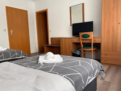 Ein Bett oder Betten in einem Zimmer der Unterkunft Hotel & Restaurant Dalmacija Polch