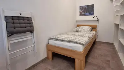 Ein Bett oder Betten in einem Zimmer der Unterkunft Gemütliche Ferienwohnung Reinsfeld