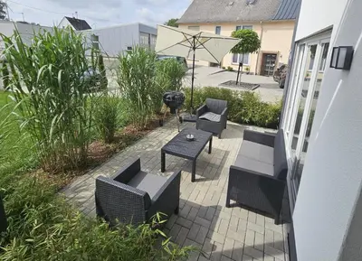 Ein Garten an der Unterkunft Haus am Brunnen Wohnung 1