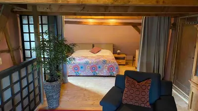 Ein Bett oder Betten in einem Zimmer der Unterkunft Ferienwohnung Kunstscheune Mosel