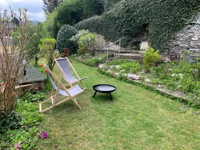 Ein Garten an der Unterkunft Turteltäubchen am Taubenhaus Residenz Moselliebe