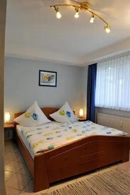 Ein Bett oder Betten in einem Zimmer der Unterkunft Ferienwohnung VINARIA