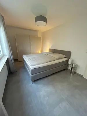 Ein Bett oder Betten in einem Zimmer der Unterkunft Moderne Ferienwohnung 