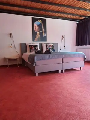 Ein Bett oder Betten in einem Zimmer der Unterkunft B&B Am Sahrbach