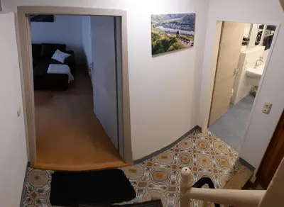 Ein Bett oder Betten in einem Zimmer der Unterkunft Ferienwohnung Roter Riesling