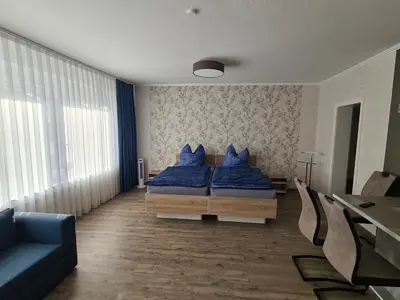 Ein Bett oder Betten in einem Zimmer der Unterkunft Ferienwohnung in der Marktstraße