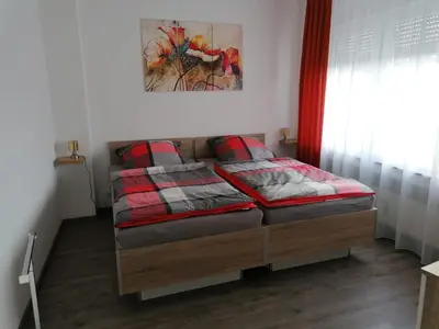 Ein Bett oder Betten in einem Zimmer der Unterkunft Ferienwohnung in der Marktstraße