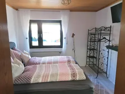 Ein Bett oder Betten in einem Zimmer der Unterkunft Ferienwohnung Christine mit Sauna und Whirlpool